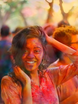 5384614-woman-female-colour-color-power-festival-pigment-crowd-group-pink-orange-bokeh-blur-smile-fun-holi-light-day-sun-girl-public-domain-images