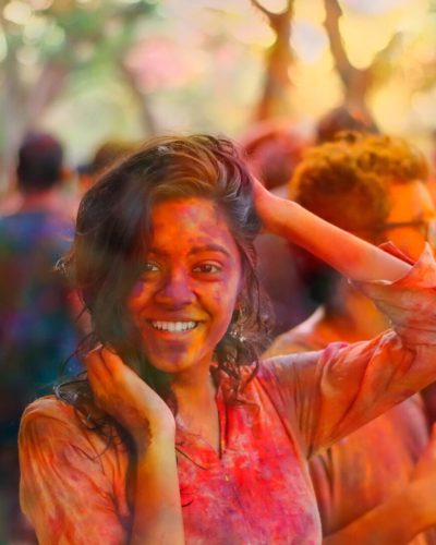 5384614-woman-female-colour-color-power-festival-pigment-crowd-group-pink-orange-bokeh-blur-smile-fun-holi-light-day-sun-girl-public-domain-images