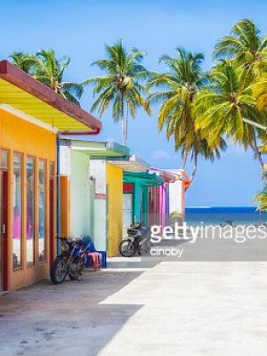 Shopping street with typically colorful house facades in Maafushi a local island in the Maldives.