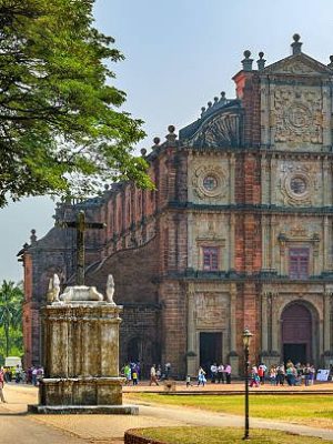 Old Goa, India - November 13, 2012: Unidentified tourists visit to the famous landmark - Basilica of Bom Jesus (Borea Jezuchi Bajilika) in Old Goa, India. Basilica is a UNESCO World Heritage Site.